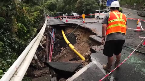 Hong Kong: Clean-up begins after record rainfall kills two, leaving others without running water