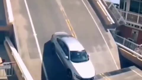 Car crash bridge: Weird moment caught on camera