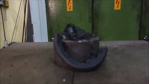 Crushing hockey puck with hydraulic press