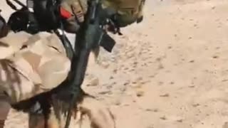 soldier jumping from helicopter with his dog