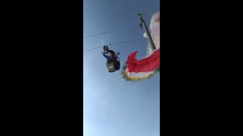 Paraglider gets stuck in telephone wires