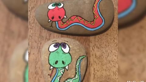 lovely mosnter painting on rocks and pebble