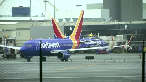 Southwest slashes more flights over storm woes