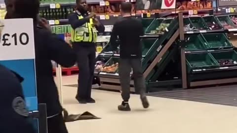 Tesco in Portsmouth Man fighting with security then a member of public takes it into his own hands.