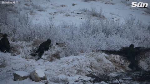 Russian troops carry out tank and artillery drills in harsh winter conditions