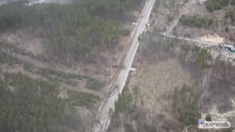 Ukraine war drone footage APCs burning and moving on the road around Kiev