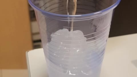 Pouring cold water into a cup