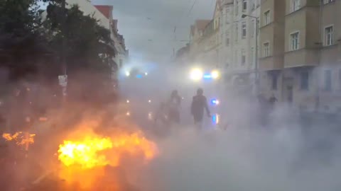 Police use water cannons to put out fires set by Antifa in Germany