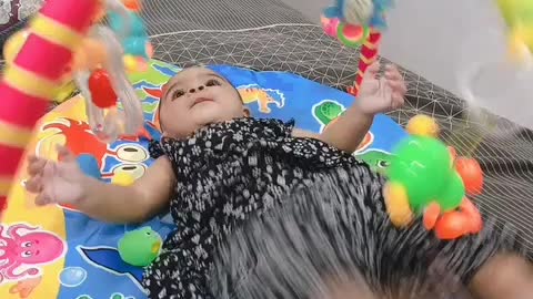 Cute Baby playing with her Toys!