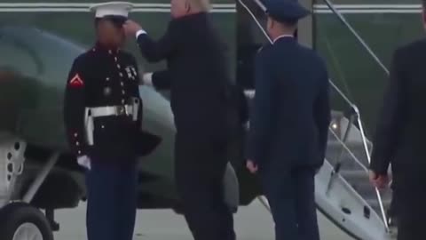 President Trump pick up marine's Hat After wind knocked it off