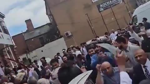 Muslims celebrate in Birmingham while brandishing knives and swords.