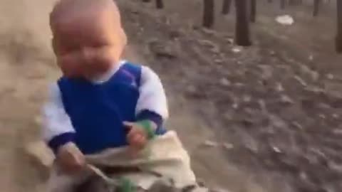 Baby Rides A Dog Full Speed