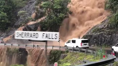 Flooding Waterfall Threatens Bridge