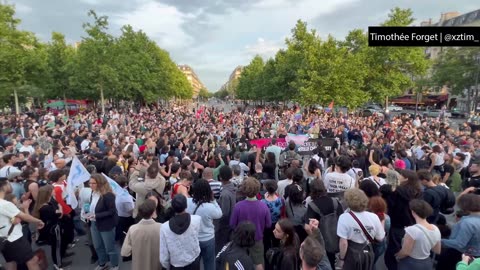 Angry crowds gathering at the Place de la République in Paris