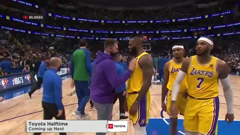LBJ clearly pointing out that PURPLE hoodie when chatting with Luka Doncic 👀