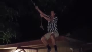 Guy roof rope swing lands on butt