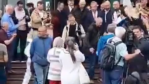 English politician Nigel Farage was doused as he was leaving a conference.