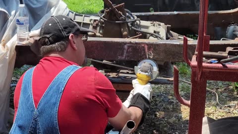 Allen in his Super Mario Cosplay Working on His Jeep