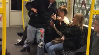 Man on subway hat on head