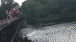 Jumping Off a Bridge Close to a Train as it Approaches