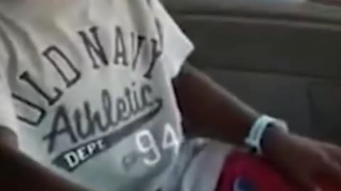 Black funny kid laughing in a car. #laughing sound affect for memes