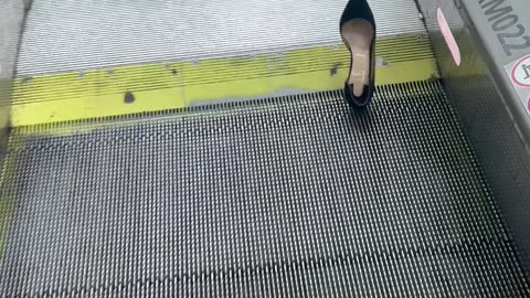 Shoe Stuck In The Moving Sidewalk