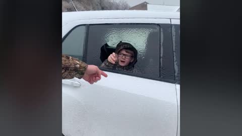 Parents Prank Kid By Asking Him To Break Ice Off Their Car Window