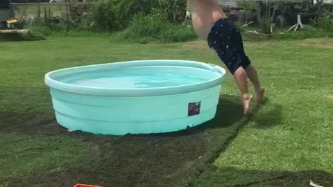 Bellyflop in blue kiddie pool