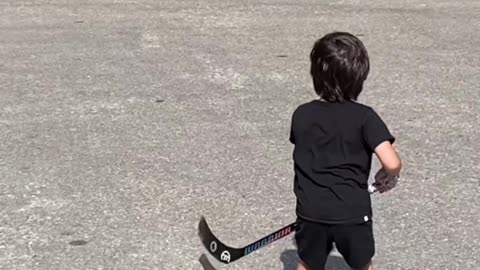 Boy Makes Incredible Trick Shots With Hockey Stick