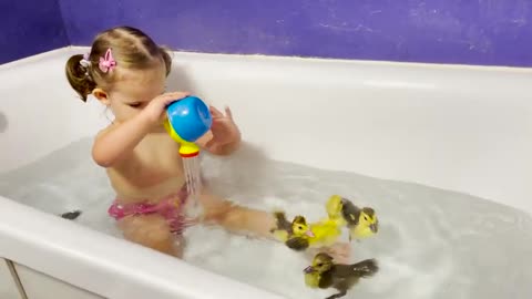 Cute_Baby_Bathes_Funny_Ducklings_in_the_Bathroom