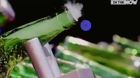 Man opens beer bottles with air rifle shot
