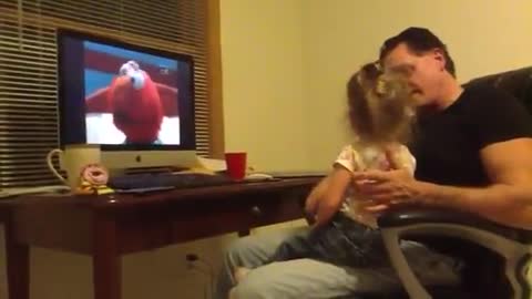 Little girl scolds dad for laughing at Elmo