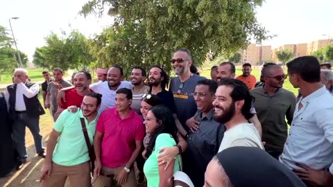 Egyptian activist hugs supporters after pardon