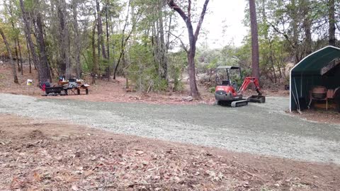 1.5" - rock delivered on 160 feet of dirt driveway and adding a covert pipe