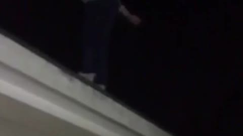 Backflip off a roof blue shirt