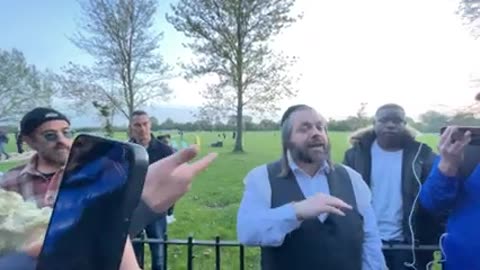 Hasidic Jew surrounded by Arabs debating Israel Palestine