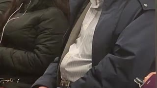 Old man on subway train sings opera out loud