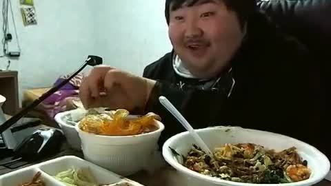 Funny asian man (too happy to eat food)