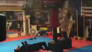 Slowmo guy cartwheels into kick and falls on back