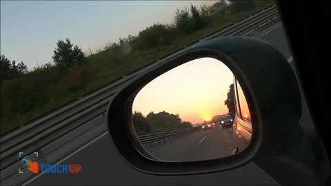 Overtaking view of cars from a side mirror [Luxury Lifestyle]