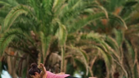 An elderly woman doing yoga