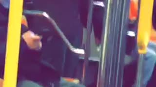 Guy flails hand on subway train