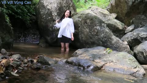 watching a pretty girl bathing in a stream in the forest