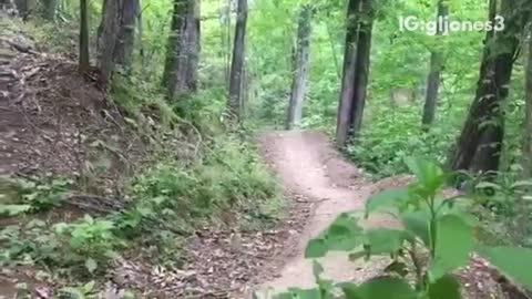 Guy in blue dirt bike fall from trail