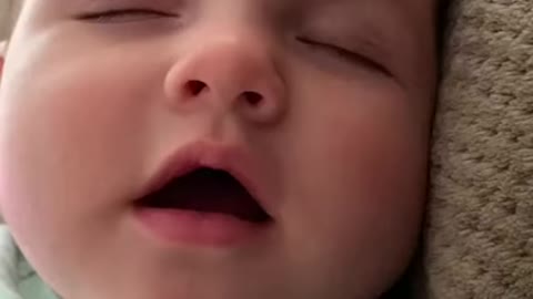 Cute Baby saying Mama while sleeping
