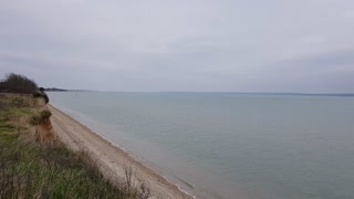 Over a cliff looking at the shore