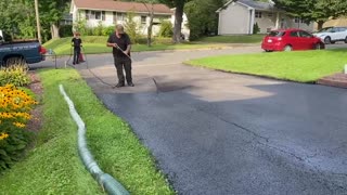 Professional Asphalt Spray Sealing: “The Extended Drain Pipe One” Top Coats Pavement Maintenance