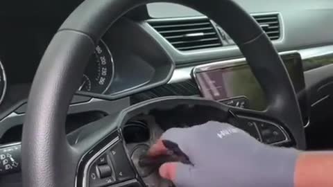 The mechanic removes the steering wheel and replaces it