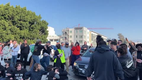 Some commuters began physically pushing and grappling protesters on the 110 freeway.