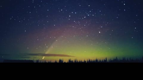 Comet Drifts Though Northern Lights